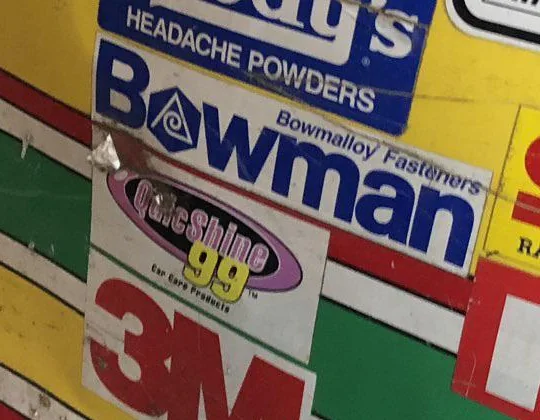 Close-up of the QuicShine 99 Car Care Products contingency decal above the 3M decal on the Winston Cup panel.